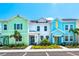 Colorful townhomes featuring unique designs and well-maintained landscaping offer a vibrant community atmosphere at 3192 Caribbean Soul Dr, Kissimmee, FL 34747
