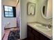 Bathroom with tile floor, single vanity and sink, and large window for plenty of natural light at 324 Bonita Rd, Debary, FL 32713