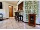 Breakfast bar with black stools, marble countertops, and decorative lighting at 324 Bonita Rd, Debary, FL 32713