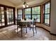 Bright breakfast nook with tile floors, table and seating, and views of the landscaped yard at 324 Bonita Rd, Debary, FL 32713