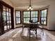 Bright breakfast nook featuring tile floors and a bay window overlooking the backyard at 324 Bonita Rd, Debary, FL 32713