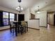 Well-lit dining area with tile floors and a view into the hallway at 324 Bonita Rd, Debary, FL 32713