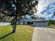 Charming single-story brick home featuring a two-car garage and well-maintained lawn at 324 Bonita Rd, Debary, FL 32713