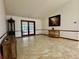 Spacious living room with tile flooring, neutral walls, and doors to the backyard at 324 Bonita Rd, Debary, FL 32713