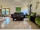 Inviting living room features tile floors, comfortable seating, and large windows at 324 Bonita Rd, Debary, FL 32713