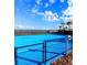 Bright blue outdoor basketball court with a fence, offering a great space for sports and recreation at 3990 Lana Ave, Davenport, FL 33897