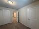 A well-lit bedroom features neutral paint, plush carpeting, and ample closet space for comfort and storage at 3990 Lana Ave, Davenport, FL 33897