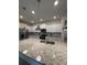 Bright kitchen featuring a granite island, stainless steel appliances, and white cabinets at 3990 Lana Ave, Davenport, FL 33897