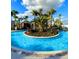Relaxing lazy river with lush landscaping, perfect for a calming float at 3990 Lana Ave, Davenport, FL 33897