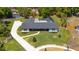 Aerial view of an updated ranch home featuring a long driveway, pool, and large backyard at 400 Royal Palm Ct, Longwood, FL 32779