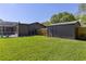Well-maintained backyard featuring a shed, green lawn, and screened-in pool, perfect for outdoor enjoyment at 400 Royal Palm Ct, Longwood, FL 32779