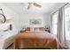 Comfortable bedroom with a plush bed, ample lighting, and tasteful decor at 400 Royal Palm Ct, Longwood, FL 32779