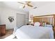 Charming bedroom featuring a cozy bed, stylish decor, and a view to the natural scenery at 400 Royal Palm Ct, Longwood, FL 32779