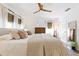 Bright and spacious bedroom with neutral tones, soft bedding, and ample natural light at 400 Royal Palm Ct, Longwood, FL 32779