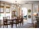 Well-lit dining room with access to the kitchen and living area at 400 Royal Palm Ct, Longwood, FL 32779