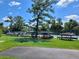 Kayaks stored near a tennis court showcase outdoor recreational opportunities in the community at 400 Royal Palm Ct, Longwood, FL 32779