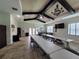 Spacious meeting room featuring a modern chandelier, dark beams, and tile floors at 400 Royal Palm Ct, Longwood, FL 32779