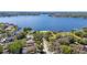 An aerial view of lakefront neighborhood showcasing numerous homes and the lake at 400 Royal Palm Ct, Longwood, FL 32779