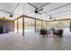 Covered patio features an outdoor living area, ceiling fans, and views of the private pool at 400 Royal Palm Ct, Longwood, FL 32779