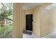 Close-up of the unit's front door, showcasing its private entrance and welcoming ambiance at 404 Summit Ridge Pl # 110, Longwood, FL 32779