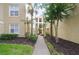 Inviting entryway leads through manicured landscaping to this charming condo building at 404 Summit Ridge Pl # 110, Longwood, FL 32779
