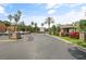 A spacious parking lot with lush tropical landscaping and palm trees with easy access to the community at 404 Summit Ridge Pl # 110, Longwood, FL 32779