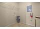 Functional utility room with storage shelving and tile floors for easy maintenance at 404 Summit Ridge Pl # 110, Longwood, FL 32779