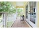 Inviting balcony with tile flooring, white railings, and a picturesque view, perfect for outdoor relaxation at 4720 Hemingway House St, Kissimmee, FL 34746