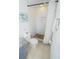 Bathroom featuring toilet, shower with white herringbone tile and pebbled floor, and granite countertop at 4720 Hemingway House St, Kissimmee, FL 34746