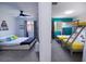 Unique bedroom layout featuring a modern bed and bunk beds separated by a partial wall, perfect for shared spaces at 4720 Hemingway House St, Kissimmee, FL 34746