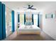 Serene bedroom with neutral tones, ample natural light, and private balcony access at 4720 Hemingway House St, Kissimmee, FL 34746