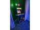 Arcade game with turtles theme, neon playstation sign, and matching stool in game room at 4720 Hemingway House St, Kissimmee, FL 34746