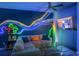 Living room with an accent wall, LED lighting, and a large sectional sofa at 4720 Hemingway House St, Kissimmee, FL 34746