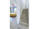 Well-lit staircase leading to a beautifully decorated bedroom at 4720 Hemingway House St, Kissimmee, FL 34746