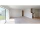 Open living area showcasing natural light, access to backyard, and staircase at 4747 Cloister St, Kissimmee, FL 34758
