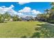 Spacious backyard bordered by fencing, mature trees, and manicured landscaping, ideal for outdoor enjoyment at 673 Balmoral Rd, Winter Park, FL 32789