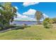 Lush backyard with a boat dock and serene lake views, perfect for outdoor living and entertaining at 673 Balmoral Rd, Winter Park, FL 32789