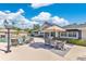 Expansive backyard featuring a pool, an outdoor dining area, and a glimpse of the inviting home design at 673 Balmoral Rd, Winter Park, FL 32789