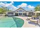 Stunning backyard with a pool, lounge chairs, and ample seating, perfect for outdoor gatherings and relaxation at 673 Balmoral Rd, Winter Park, FL 32789