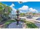 Beautiful backyard with a fountain and stylish outdoor dining, creating a serene oasis for relaxation and entertainment at 673 Balmoral Rd, Winter Park, FL 32789