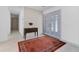 Bright foyer featuring tiled floors, a console table, and a stylish double door entry at 673 Balmoral Rd, Winter Park, FL 32789