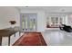 Bright foyer featuring tiled floors, a console table, and a stylish double door entry at 673 Balmoral Rd, Winter Park, FL 32789