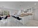 Spacious kitchen with white cabinets, an island, black countertops, stainless steel appliances, and an eat-in area at 673 Balmoral Rd, Winter Park, FL 32789