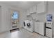 The Laundry Room has a door to outside, washer and dryer at 673 Balmoral Rd, Winter Park, FL 32789