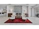 Cozy living room featuring a decorative fireplace, comfortable seating, and an elegant tiled floor at 673 Balmoral Rd, Winter Park, FL 32789