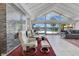 Bright living room with a vaulted ceiling, fireplace and sliding glass doors that overlook the pool and backyard at 673 Balmoral Rd, Winter Park, FL 32789