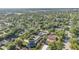 An aerial view of a neighborhood surrounded by lush green trees and landscaping at 690 S Lakemont Ave, Winter Park, FL 32792