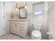 Traditional bathroom featuring a vanity with storage, a toilet, and tile flooring at 690 S Lakemont Ave, Winter Park, FL 32792