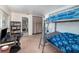 Comfortable bedroom with bunk bed, desk and shelves that offer a lot of storage at 690 S Lakemont Ave, Winter Park, FL 32792