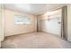 Comfortable bedroom with natural light, carpet floors, and a built-in closet at 690 S Lakemont Ave, Winter Park, FL 32792